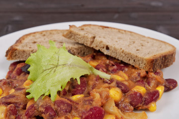 Cowboy beans with bread on a table