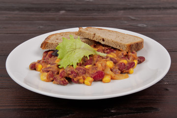 Cowboy beans with bread on a table