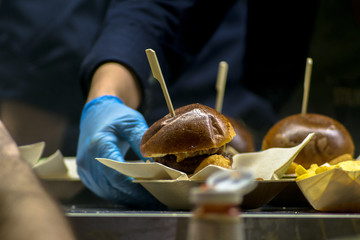 Burger served at a fast food festival. Burger served on a fast food van