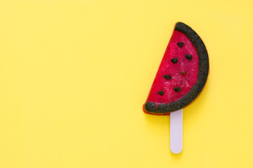 Watermelon popsicle on yellow background. Copyspace.

