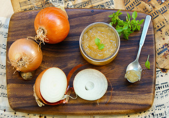 onion marmalade (jam) onion confiture on a rustic wood 
