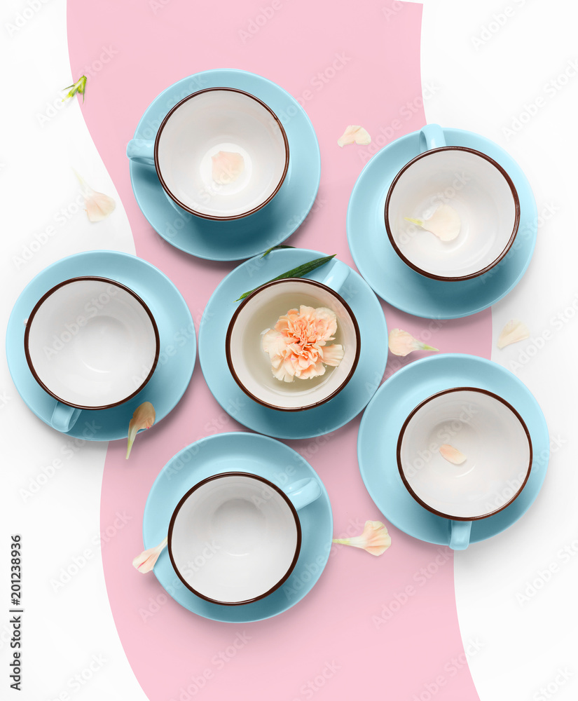 Wall mural elegant porcelain blue and pink cups on abstract background