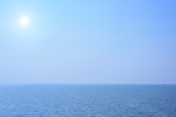 Blue sea and blue sky with sun
