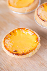 Closeup of egg tart on wooden table
