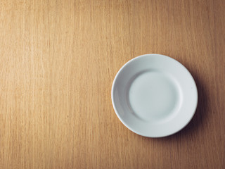 Empty Plate on wooden background