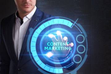 Business, Technology, Internet and network concept. Young businessman working on a virtual screen of the future and sees the inscription: Content marketing