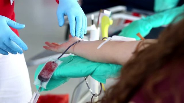 Blood donator donates blood in the hospital
