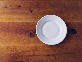 Fototapeta na wymiar Empty Plate on wooden background