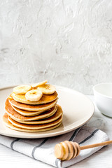 cooked pancake on plate at wooden background