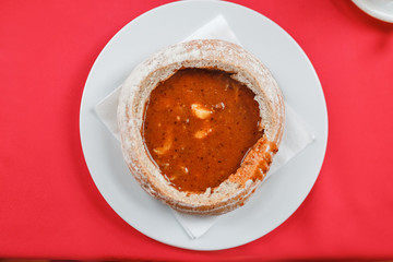 Hot Hungarian goulash soup in a bread pot