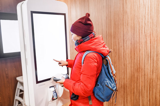 A Woman At The Touch Screen Payment Terminal