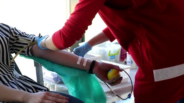 Blood donator donates blood in the hospital
