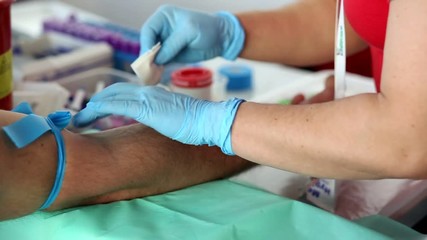 Volunteers are donating blood at the World Blood Donor Day 

