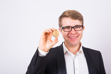 Wooden Bitcoin in funny man hand, Digital symbol of a new virtual currency