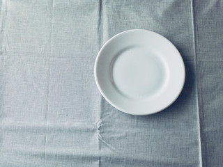 Empty Plate on fabric background