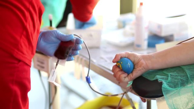 Blood donator donates blood in the hospital
