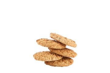 Stack of healthy vegan integral cookies made of hazelnut powder & linseed isolated on white background. Home made vegetarian sugarless & gluten free snack with nuts. Close up, copy space, top view.