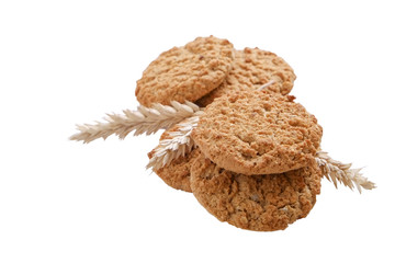 Healthy vegan integral cookies made of hazelnut powder & linseed isolated on white background. Home made vegetarian sugarless & gluten free snack w/ nuts. Decorative wheat spica. Close up, copy space.