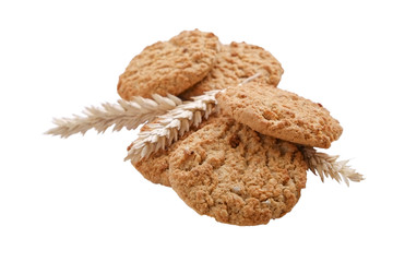 Healthy vegan integral cookies made of hazelnut powder & linseed isolated on white background. Home made vegetarian sugarless & gluten free snack w/ nuts. Decorative wheat spica. Close up, copy space.