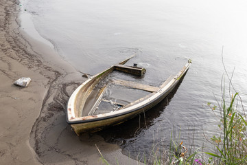 sinking boat in the harbor of the Campi Flegrei (Phlegraean Fields)