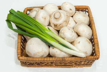 Fresh champignons with green onions
