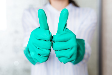 Maid in gloves lifted her fingers up