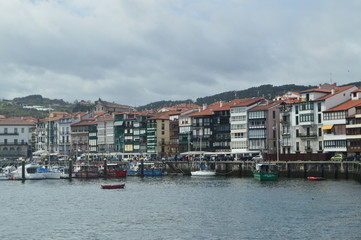 Obraz premium Beautiful Shot Of The Wooden Buildings Of The Port District On The Bay Taken From The Lonja De Lekeitio. March 24, 2018. Architecture Nature Landscapes. Lekeitio Vizcaya Basque Country Spain.