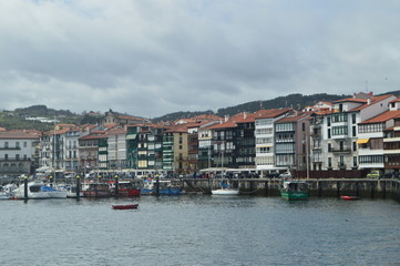 Fototapeta na wymiar Beautiful Shot Of The Wooden Buildings Of The Port District On The Bay Taken From The Lonja De Lekeitio. March 24, 2018. Architecture Nature Landscapes. Lekeitio Vizcaya Basque Country Spain.