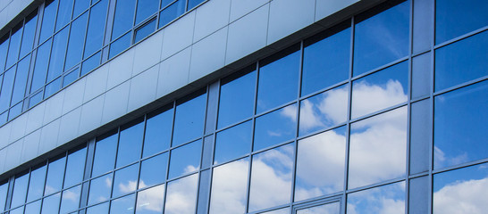 sky reflection in the Windows of the building