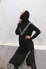 Fashion model in designers knitted clothes