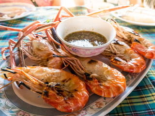 Grilled Prawns, Shrimp on a Plate with Dipping Spicy Seafood, Popular Thai Cuisine.