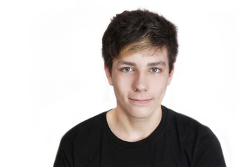 Portrait of a beautiful teenager with dark hair and beautiful eyes on a white background