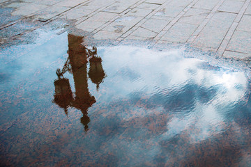 light reflection in puddle. rainy weather