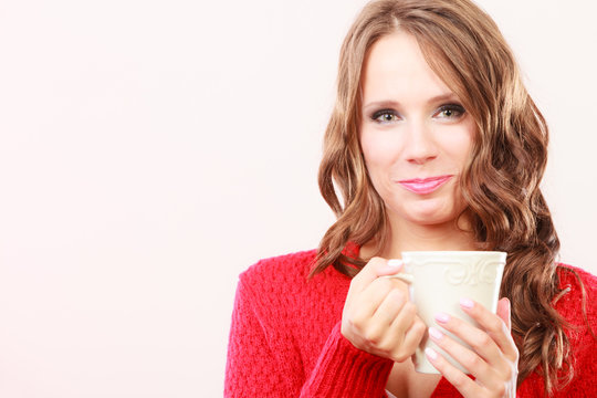 Autumn woman holds mug with coffee warm beverage