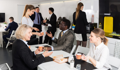 people  at a coffee break in the office