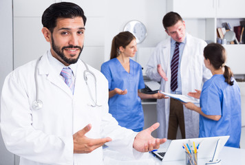 Fototapeta premium Male doctor welcoming to clinic