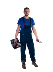 Portrait of a young worker with toolbox standing on white background