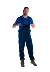 Portrait of a young plumber standing on white background
