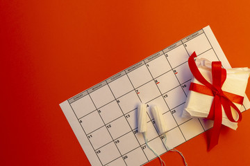 Menstruation calendar with notebook, cotton tampons, red flower. Woman critical days, woman hygiene...