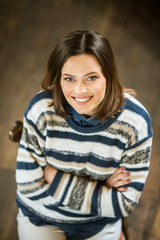 Fototapeta premium Young woman sitting in cafe and smiling