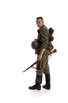 Man actor in the movie role of an old military man posing against white background