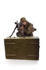Man actor in the movie role of an old military man  with a MG 42 machine gun posing against white...