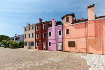 Small, cozy courtyard with colorful cottage /  Burano, Venice/ The small yard with bright walls of houses