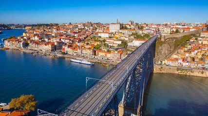 Obraz premium Panoramic view of Old city of Porto (Oporto) and Ribeira over Douro river, Portugal. Concept of world travel, sightseeing and tourism.