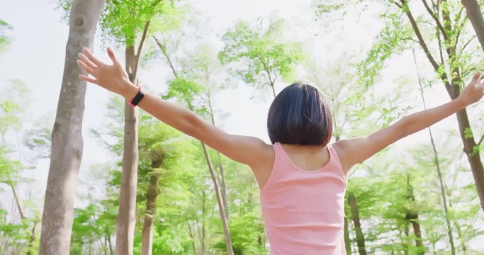 woman feel free in forest