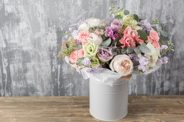 Close-up Beautiful Bouquet. Spring flowers on gray background. flower shop
