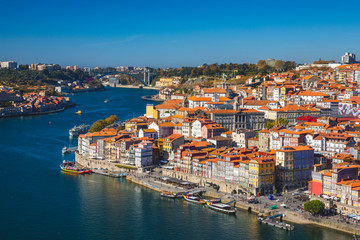 Fototapeta na wymiar Panoramic view of Old city of Porto (Oporto) and Ribeira over Douro river, Portugal. Concept of world travel, sightseeing and tourism.