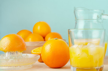 Freshly Squeezed Orange Juice in Progress on Wooden Table