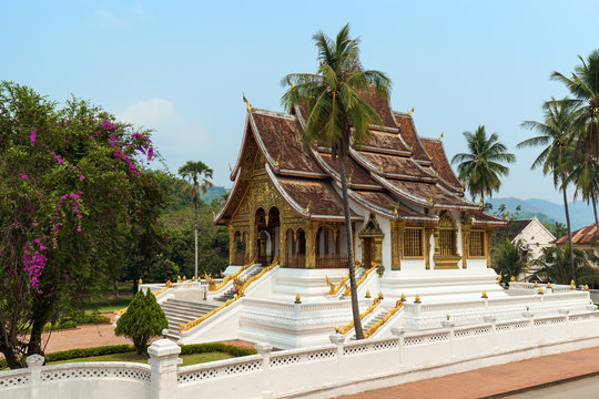View of the ornate Haw Pha Bang temple, also known as Royal or Palace Chapel. It's located next to the Royal Palace in Luang Prabang, Laos.