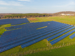 Aerial view industrial Photovoltaic solar units panels environment producing renewable green energy